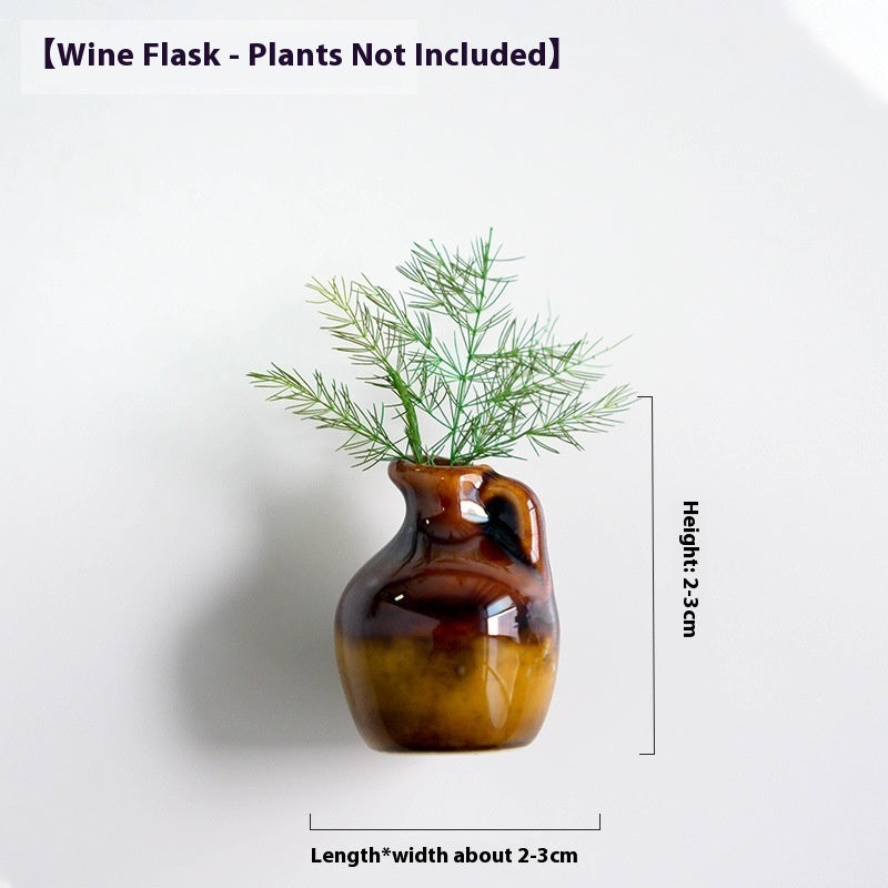 Brown wine flask with green plant on a white background, dimensions indicated.