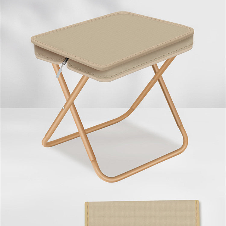 Beige folding stool on a white background