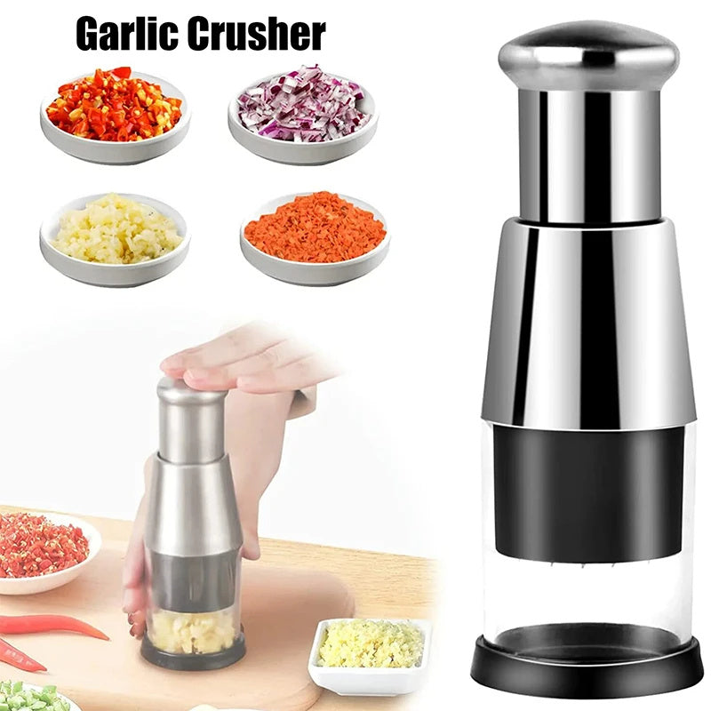 Garlic crusher with garlic, onions, and other vegetables on a white background