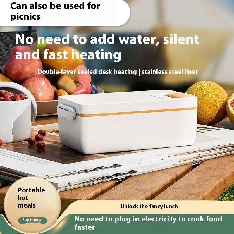 White desk heating pad on a picnic setup with fruits and a fishing rod.