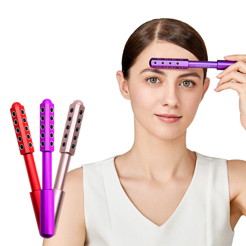 Woman using a purple hair styling tool with two other tools on a white background