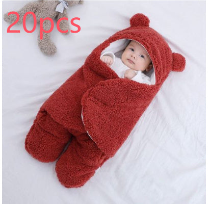 Baby wrapped in a red fluffy swaddle with a bear hat on a white background, with '20 pcs' text above.