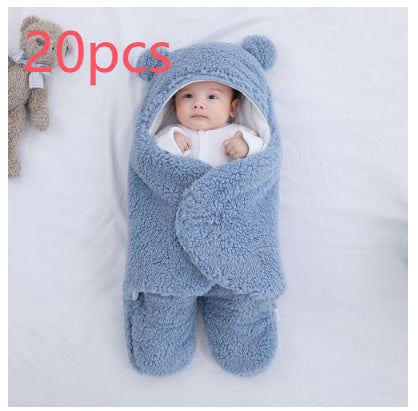 Baby in a blue bear-shaped swaddle on a white background with '20pcs' text.