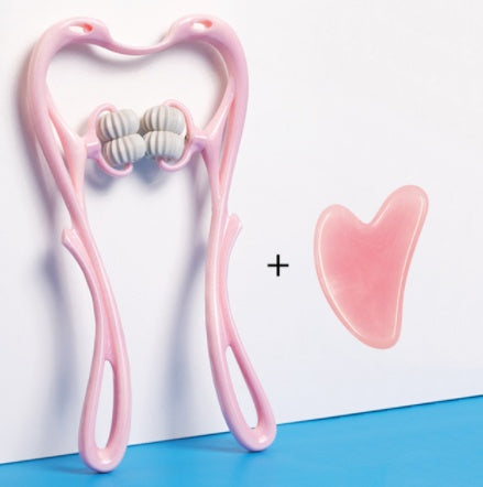 Pink facial roller and gua sha tool on a white and blue background