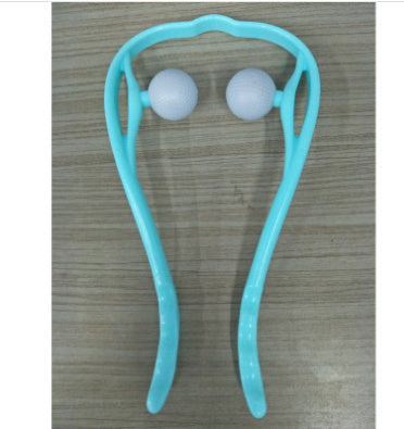Turquoise handheld massager with two white balls on a wooden surface