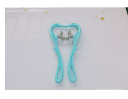 Blue hair tie on a white background with yellow dots