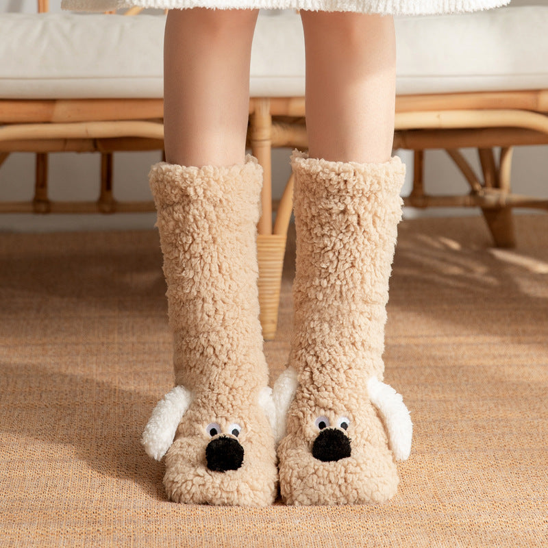 Beige fuzzy slippers with dog face design worn by a person indoors.