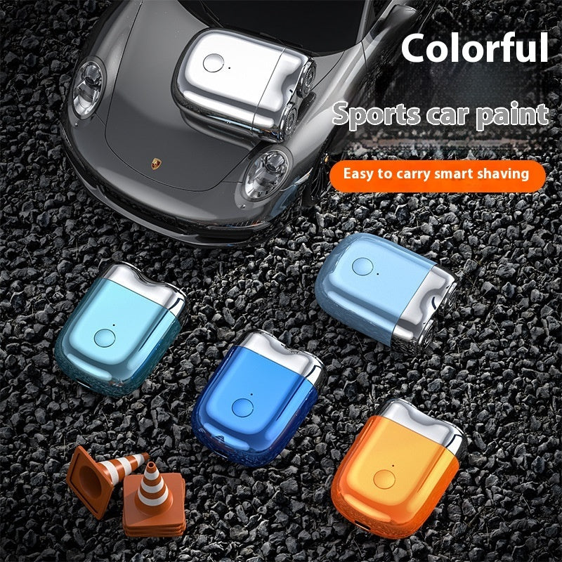 Smart shaving devices with colorful finishes on a textured surface, featuring a car in the background.