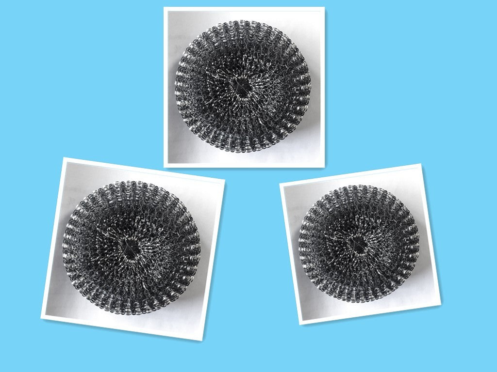 Three metallic scrubber balls on white squares against a blue background