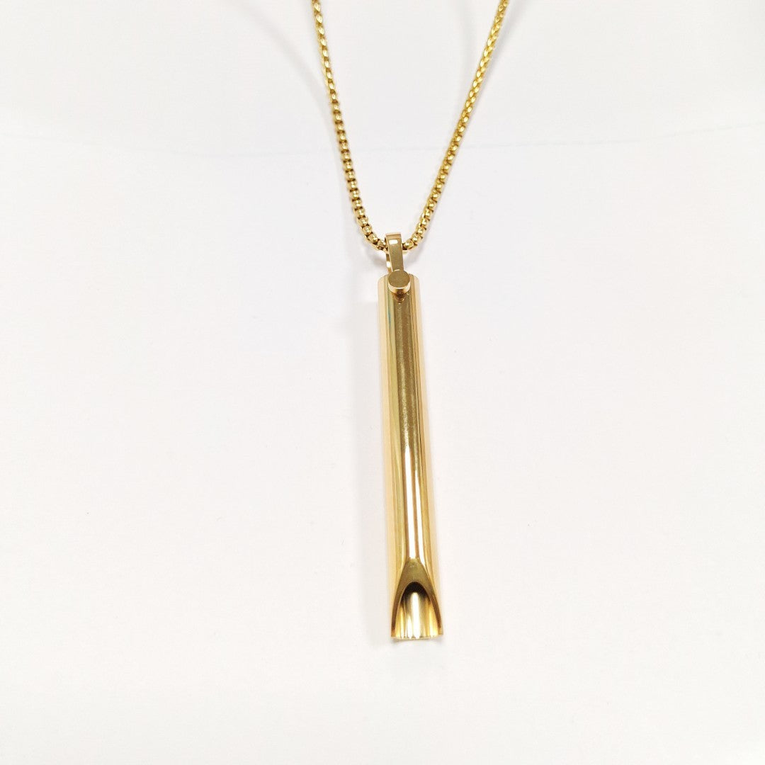 Gold necklace with a cylindrical pendant on a white background