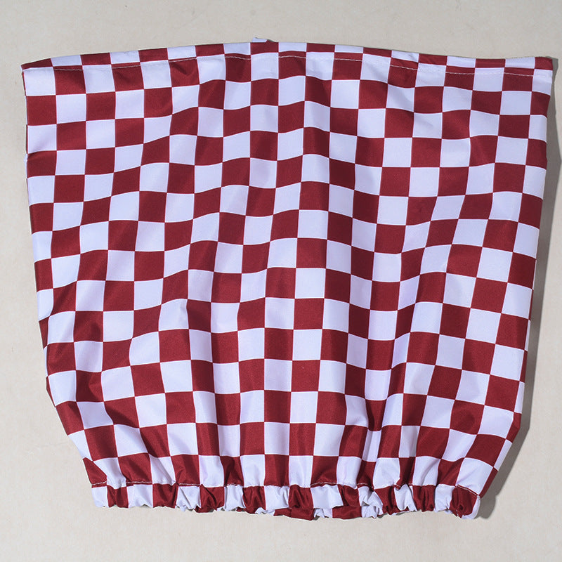 Red and white checkered fabric on a beige background