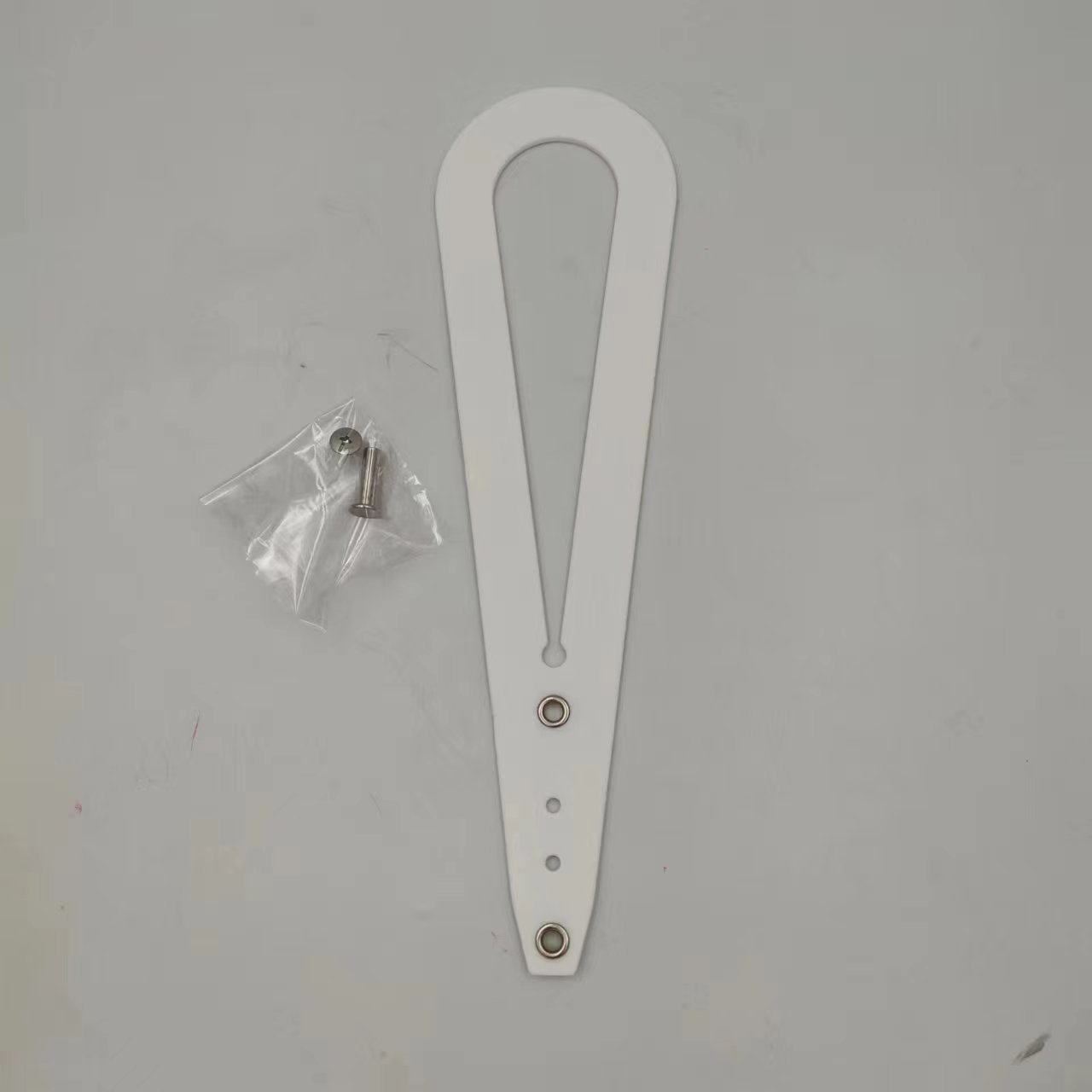 A pet cat door holder latch with a keyhole, shown in black with purple details, installed on a white door, with a cat looking at a dog through the door.