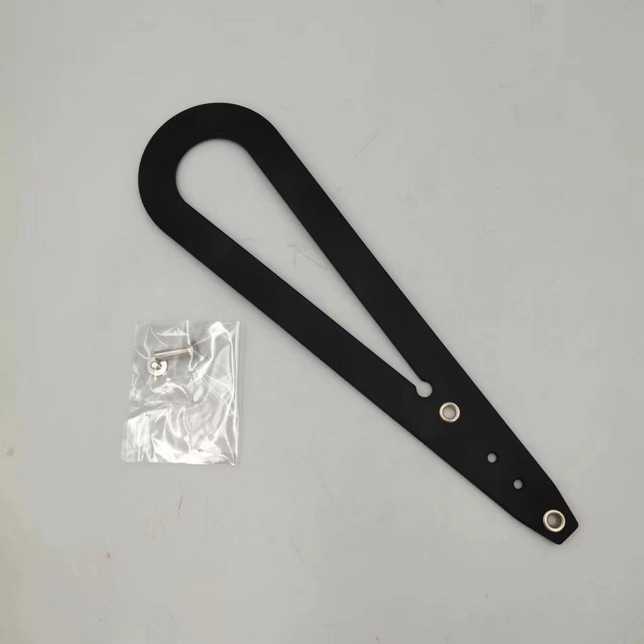 A pet cat door holder latch with a keyhole, shown in black with purple details, installed on a white door, with a cat looking at a dog through the door.